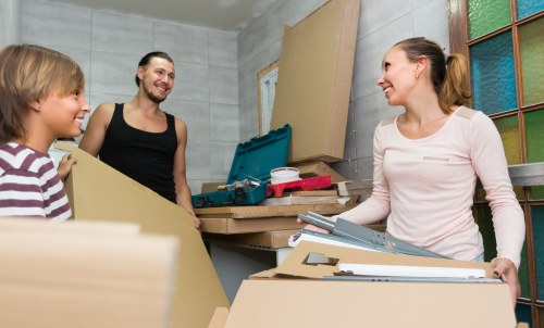 Professional removal team in Barnet handling moving boxes with care