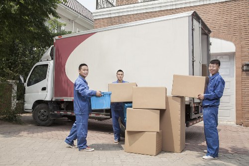Removal team preparing belongings safely with protective materials