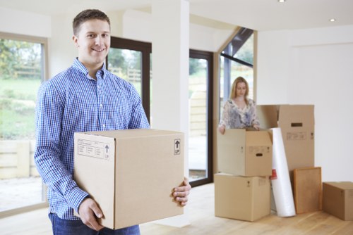 Organised office boxes and IT equipment prepared for relocation