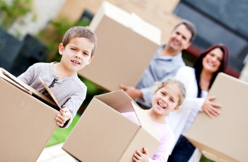 Moving crew loading furniture into a vehicle