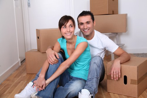 Careful loading of sofas and household furniture into a removals van